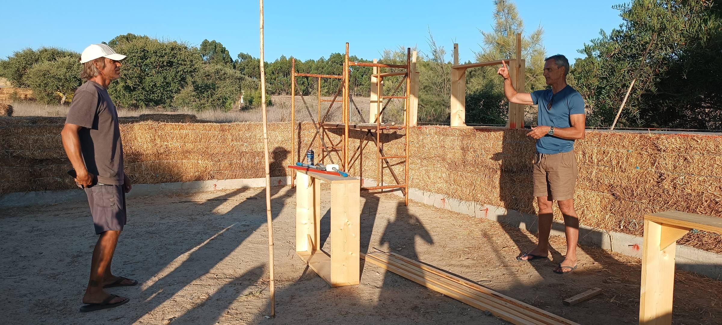 Photo from Shayna's retreat in Portugal. Tarik and Valerio talking about construction techniques for the yoga shala build project.